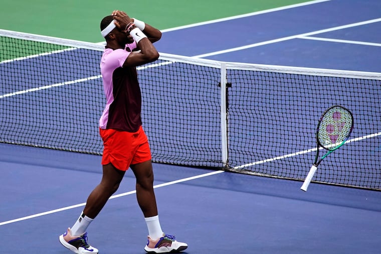 Frances Tiafoe, of the United States, celebrates after defeating Rafael Nadal, of Spain, during the fourth round of the U.S. Open tennis championships.