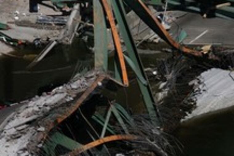 Emergency workers search the scene of Wednesday's bridge collapse. Strong currents, low visibility and sharp objects in the river was hampering the search.