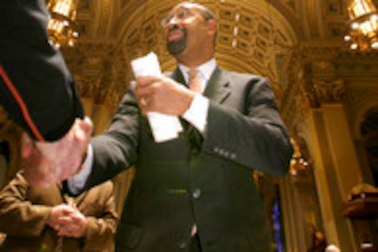 Mayor-elect Michael Nutter greets those attending a multidenominational inaugural service at the Cathedral Basilica of SS. Peter and Paul. Story and more photos, B8.