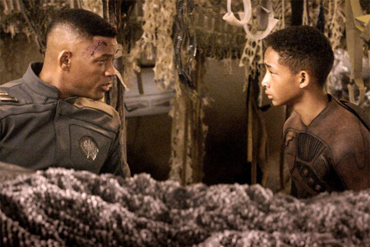Will Smith with son Jaden Smith in the sci-fi yarn “After Earth.” (Columbia Pictures)
