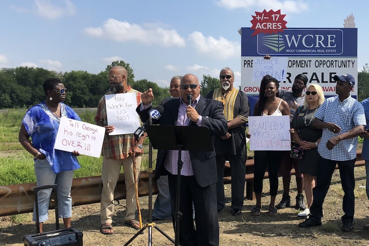 Amir Khan, with the Camden We Choose coalition, speaks at a press conference on the city's need for a supermarket on Aug. 15, 2019. Residents and community organizers taking part in the event gathered in front of a vacant lot, along Admiral Wilson Boulevard.
