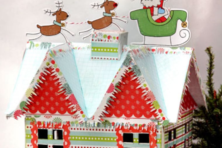 "Up on the Housetop" papier-mache holiday house as made by crafter Julia Sandvoss sits on display. Sandvoss, of South St. Louis County, Missouri, is an expert at easy holiday projects. (Christian Gooden/St. Louis Post-Dispatch/MCT)