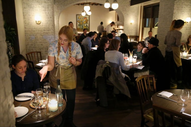 Server Maris Garden explains a cheese plate at The Love in Rittenhouse Square.