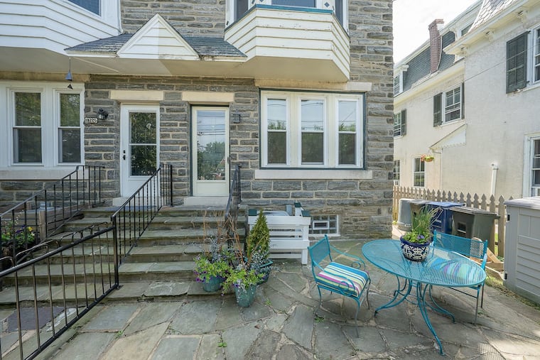 The house, which is half of a twin, has a private patio in the front and a deck in the back.