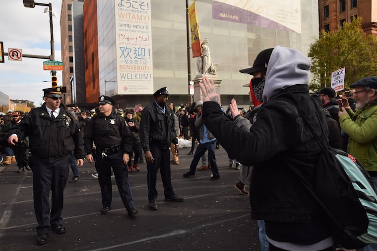 Counter protestors and police officers at odds during the "We the People Rally" in support of conservative causes at Independence Mall Philadelphia on November 17, 2018. The rally drew several dozen attendees while hundreds of protesters showed.