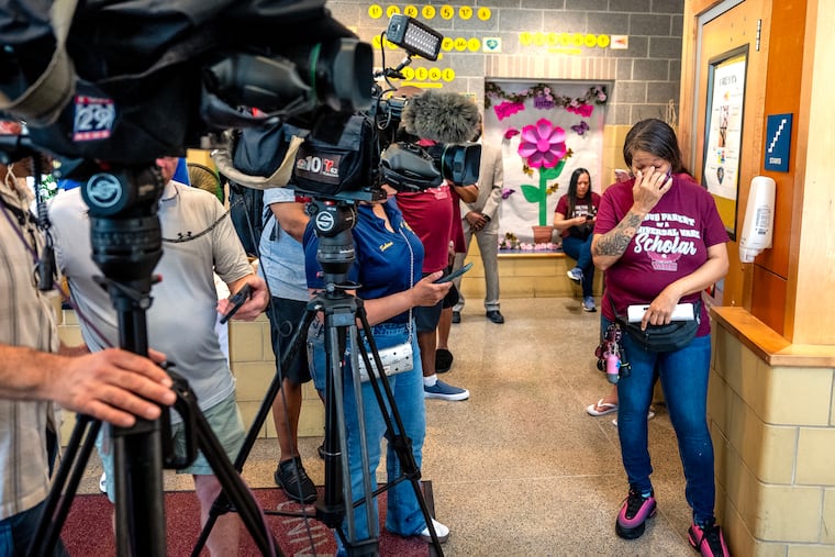 Universal Vare STEM & Arts Charter School parent representative Danielle Reavis waits before a press conference at the school, which is closing after the 2025-26 school year.