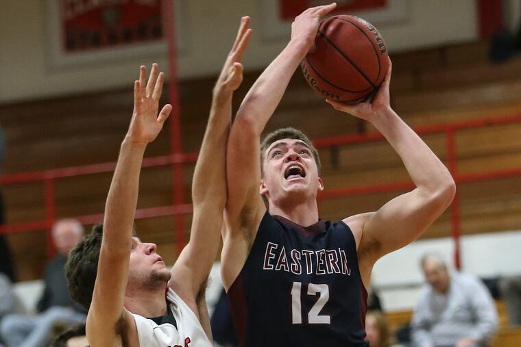 Eastern's Ryan Ems (right) shoots over Cherry Hill East's Zack Frye.