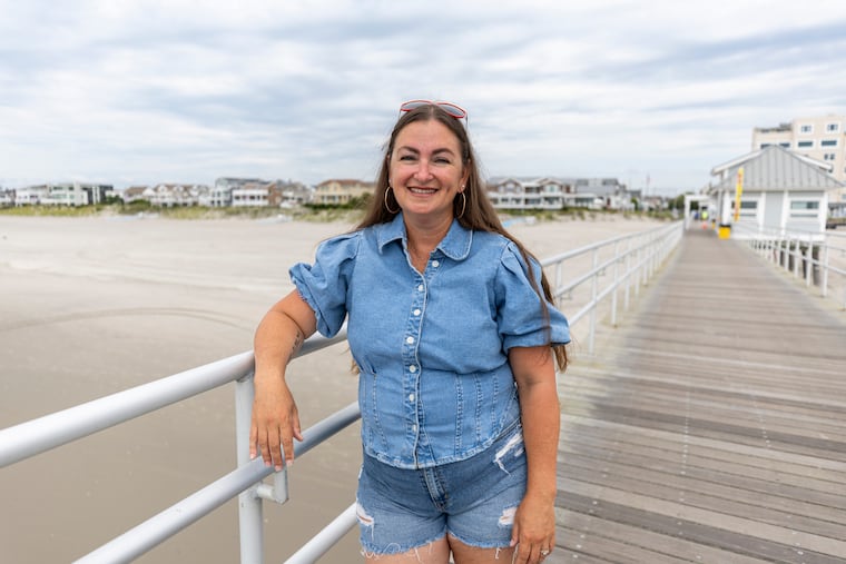 Emily Van Duyne, 44, of Ventnor City, N.J., Sylvia Plath Scholar, poses for a portrait at the Ventnor Pier in Ventnor, N.J., on Thursday, July 18, 2024.