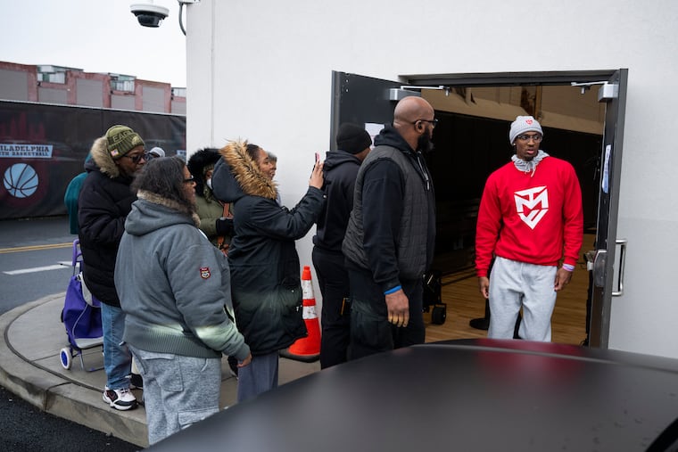 People wait in line as Philadelphia 76ers’ Tyrese Maxey’s foundation provides 3,000 turkeys to families on Saturday, Nov. 22, 2025 in Philadelphia.