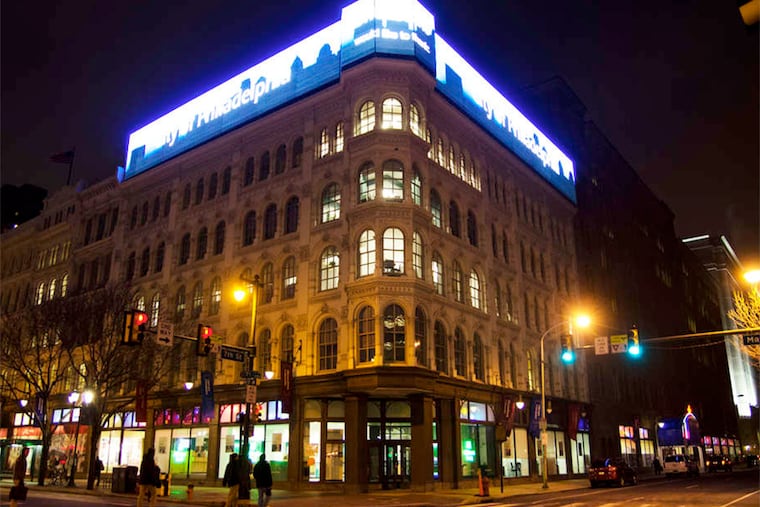 The first step in an effort to bring a little of Times Square to Market Street it the large lighted billboard atop the former Lit Bros. department store.