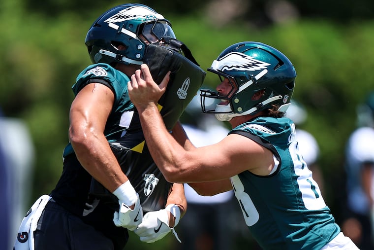 Eagles tight ends Cameron Latu (left) and Dallas Goedert work out during mandatory minicamp at the Jefferson Health Training Complex in June.