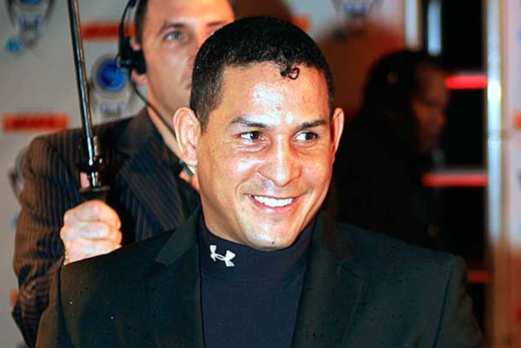 Former boxing champion Camacho has been shot and critically wounded. Camacho was shot in the face while in a car outside a bar in Bayamon, one of the cities that make up the San Juan metropolitan area. A statement from police in Bayamon said he was shot Tuesday night, Nov. 20, 2012. (Luis M. Alvarez, AP File)