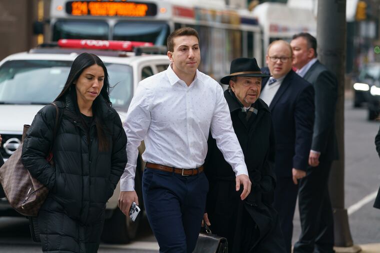 Former Temple University fraternity president Ari Goldstein, center, arrives at the Stout Criminal Justice Center in Philadelphia for the start of his rape trial on Wednesday, Feb. 12, 2020.