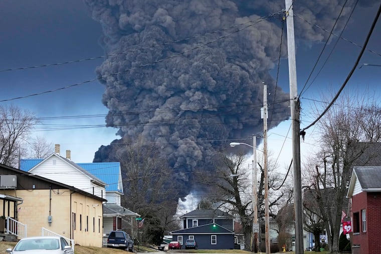 A black plume rises over East Palestine, Ohio, as a result of a controlled detonation of a portion of the derailed Norfolk Southern trains, Feb. 6, 2023.