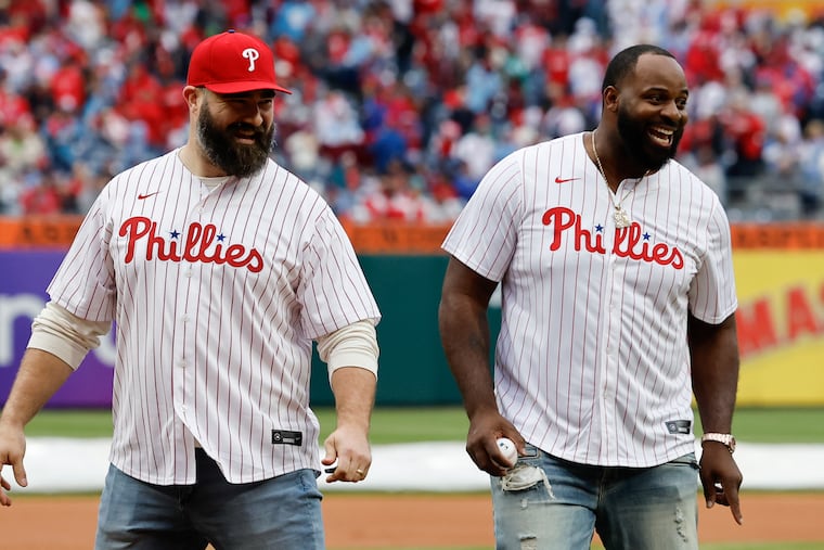 Retired Eagles center Jason Kelce (left) and defensive tackle Fletcher Cox after they threw the ceremonial first pitch before the Phillies played the Braves on opening day on March 30.