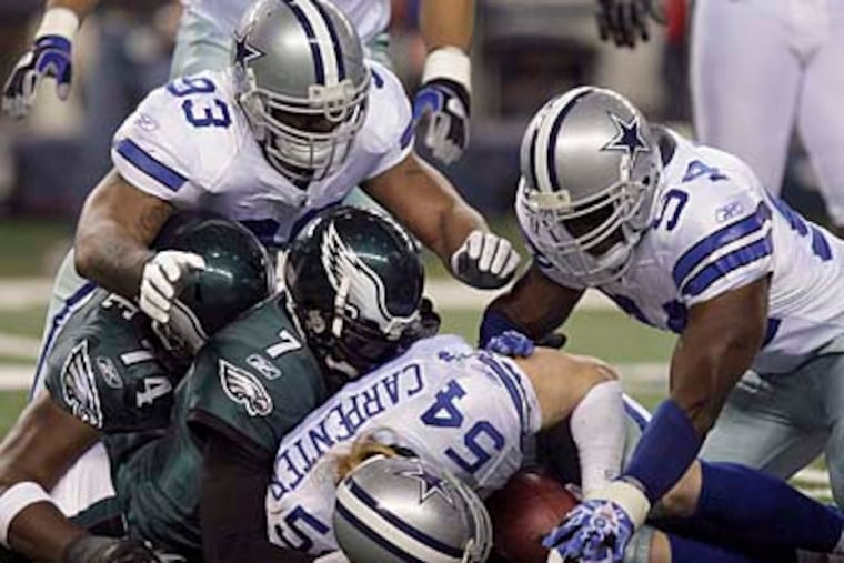 Michael Vick's fumble proved to be costly when the Cowboys offense responded with a touchdown. (Yong Kim/Staff Photographer)