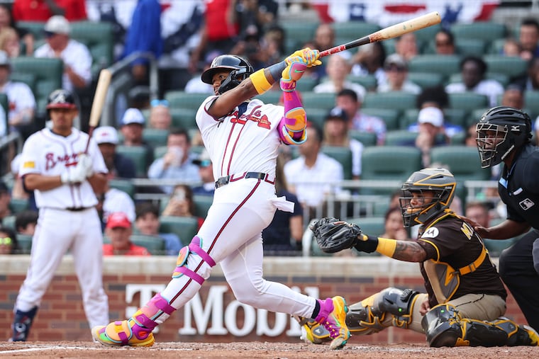 Atlanta's Ronald Acuna Jr. hits a double in the fifth inning game against the Padres on Sunday.