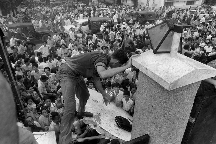 A crowd surrounds the U.S. Embassy in Saigon on April 29, 1975, hoping to escape aboard evacuation helicopters.