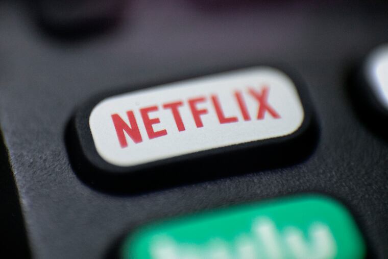 The Netflix logo is pictured on a remote control in Portland, Ore., Aug. 13, 2020. Netflix said Wednesday, Dec. 21, 2022, that it plans to build a state-of-the-art production facility at a former Army base at the Jersey Shore that will cost more than $900 million, and create thousands of jobs.