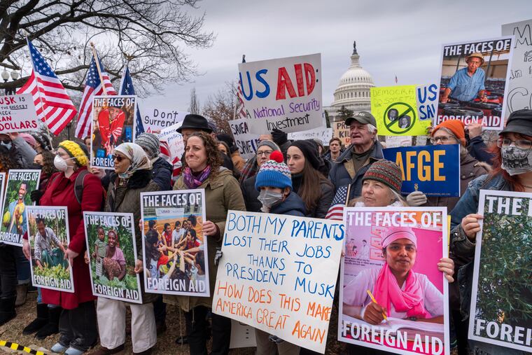 Demonstrators and lawmakers rally against President Donald Trump and his ally Elon Musk as they disrupt the federal government, including dismantling the U.S. Agency for International Development, on Capitol Hill in Washington on Wednesday, Feb. 5, 2025.