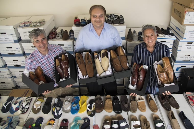 Titan Group/Chelsea Shoe Co. co-founders and partners (from left) Sandy Nydish, Bob Khan, and Bart Nydish, hold shoe boxes of their new label, Cobble & Hyde, at the company’s West Norrtion headquarters June 1, 2017. The company has been a manufacturer of shoes for other private labels and this is their first foray into their own line of premium shoes. CLEM MURRAY / Staff Photographer
