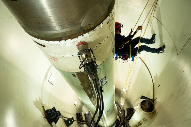 An Air Force firefighter rappels down a training missile silo during a training exercise at F.E. Warren Air Force Base in Wyoming on Oct. 26, 2024. (Hunter C. Kirkland/U.S. Air Force)