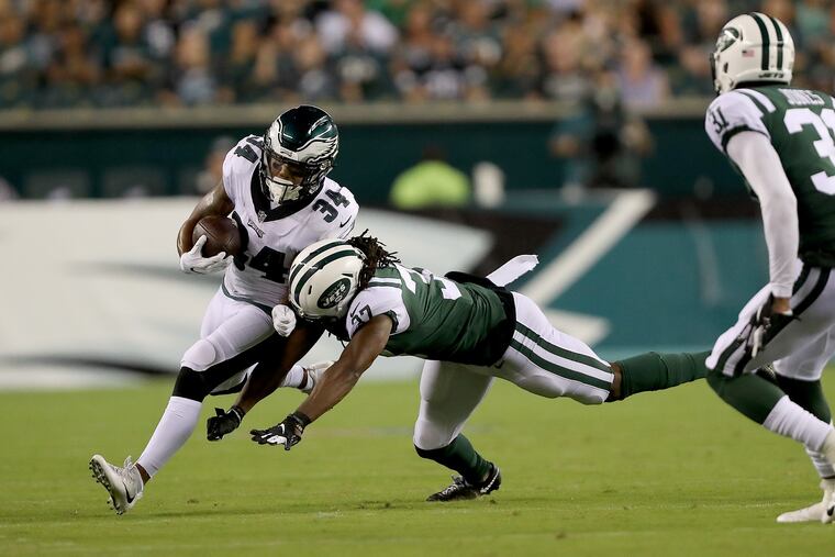 Eagles' Donnel Pumphrey, is pushed out of bounds by the Jets' J.J. Wilcox, right, during the 2nd quarter in the Eagles preseason game against the Jets in Philadelphia, PA on August 30, 2018. DAVID MAIALETTI / Staff Photographer