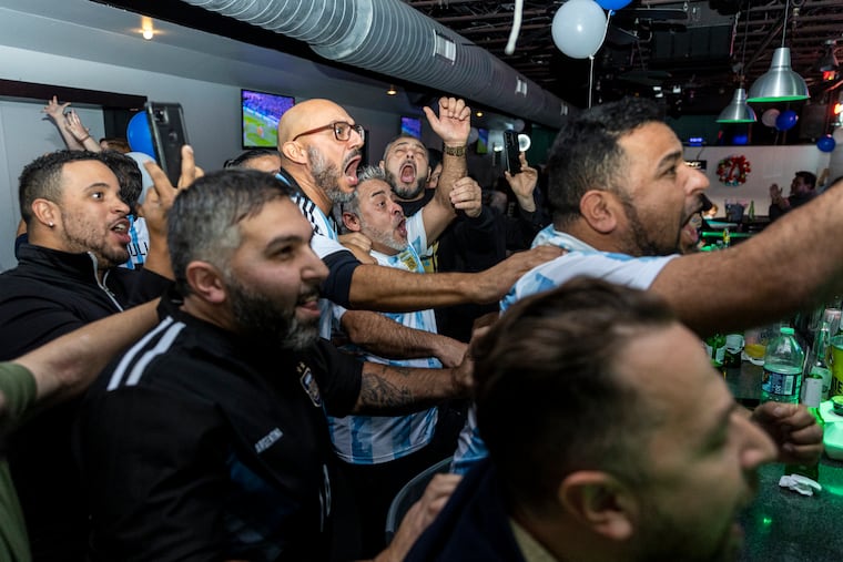 Fans cheer as Argentina scores their second goal against the Netherlands in the World Cup at Dimension Sports Bar on Dec. 9. Argentina will face Croatia in the semifinal match on Dec. 13.