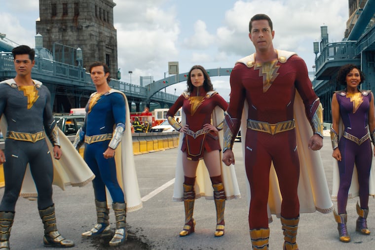 Ross Butler as Supehero Eugene, Adam Brody as Superhero Freddy, Grace Caroline Currey as Superhero Mary, Zachary Levi as Shazam, Meagan Good as Superhero Darla, and D.J. Cotrona as Superhero Pedro in "Shazam! Fury of the Gods."