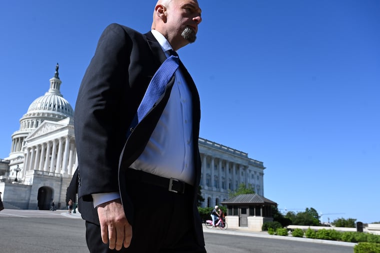 Sen. John Fetterman leaves the Capitol, walking to a committee hearing on his second day in Washington.