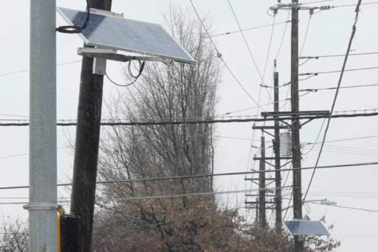Solar panels along Haddonfield-Berlin Road in Cherry Hill, N.J. Here, three solar panels near the intersection of Haddonfield Road and Chapel Avenue. ( April Saul / Staff Photographer )