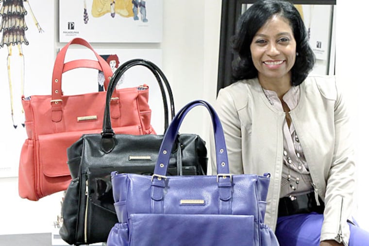 Minkeeblue President/CEO/Inventor Sherrill W. Mosee with her Minkeeblue travel and baby bags. (Elizabeth Robertson/Staff Photographer)