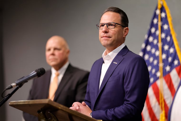 Pennsylvania State Police acting Commissioner Lt. Col. George Bivens looks on as Gov. Josh Shapiro speaks about the fatal crash in Schuylkill County that killed Trooper Michael E. Pahira Jr.