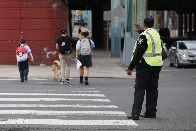 School crossing guard Aiesha Burton presides over a cleaned-up corner at Kensington and Lehigh. But around Philadelphia, many kids face evidence of the opioid crisis, on the streets and in their homes.