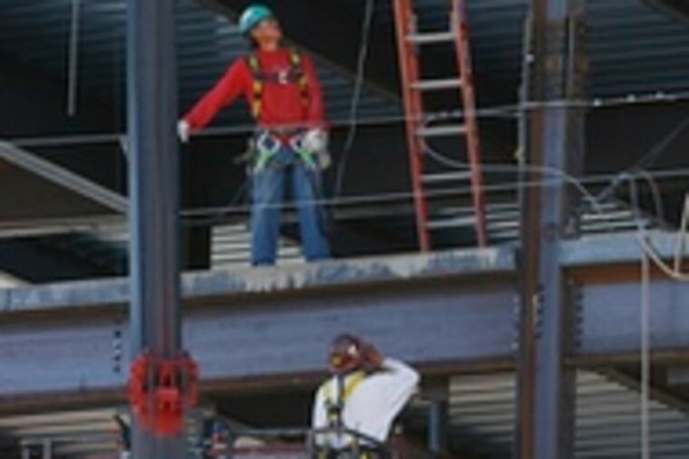Construction workers in Phoenix, above, prepare to weld. A job seeker in Brooklyn, top, seeks help at a career center. The economy added just 88,000 jobs last month. The figures suggest the labor situation is a bit weaker as the economy negotiates through a soft patch.
