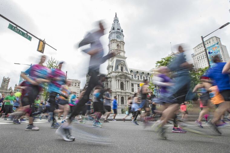 Some of the 40,000 runners in the 2017 Broad Street Run pass City Hall on their way to the finish in South Philadelphia.