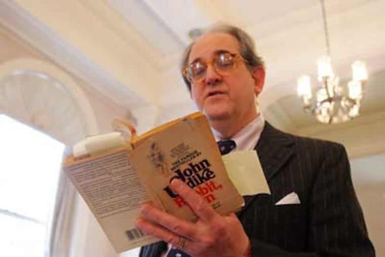 Professor Richard Androne reads from John Updike's 'Rabbit Run.' (David Swanson / Staff Photographer)