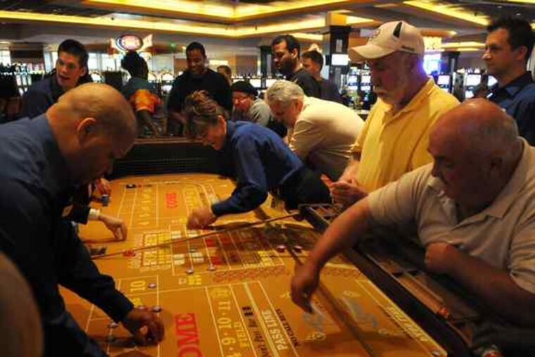 A craps table at the Rivers Casino was seeing a lot of activity Thursday. Table games, unlike slots - and craps, in particular - involve group play, a lot of camaraderie at a table, and are anything but quiet. Table games mostly draw men.