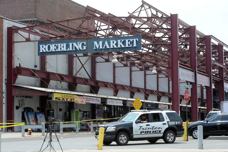 Police guard the perimeter Monday, June 18, 2018, of the scene where a shooting occurred early Sunday, June 17, 2018, that left 22 people shot or injured and a suspected gunman dead at the Art All Night festival in Trenton, New Jersey.
