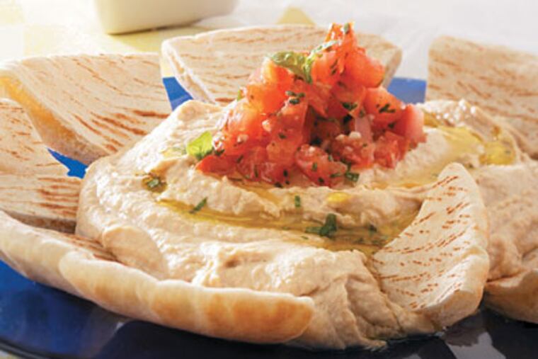 Creamy hummus with steeped tomatoes.