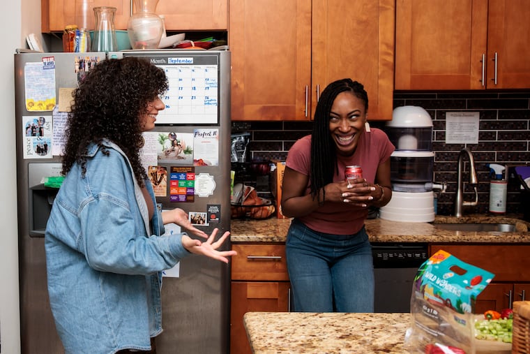 Peace Ike, right, bought the Germantown house after she had a revelation to do so. She lives there with five other women, including Kallie Jalal, left.