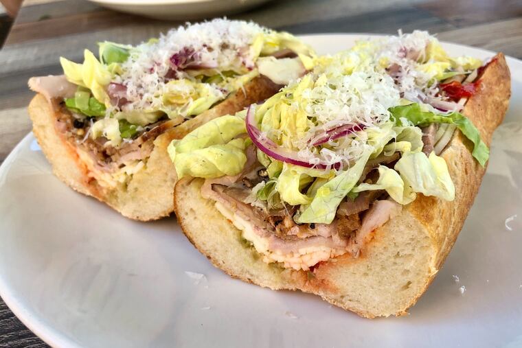 The smoked hoagie at Standard Tap is new chef Patrick Limanni's hand-crafted ode to the classic, with three kinds of house-cured and smoked meats layered with olive and pepper spreads over a fresh sourdough baguette.