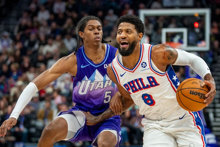 Sixers forward Paul George (8) breaks for the basket as Utah Jazz forward Cody Williams (5) defends during the first half their game on Saturday.