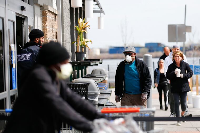 Shoppers enter the Walmart Supercenter store on Christopher Columbus Boulevard in South Philadelphia on April 5.
