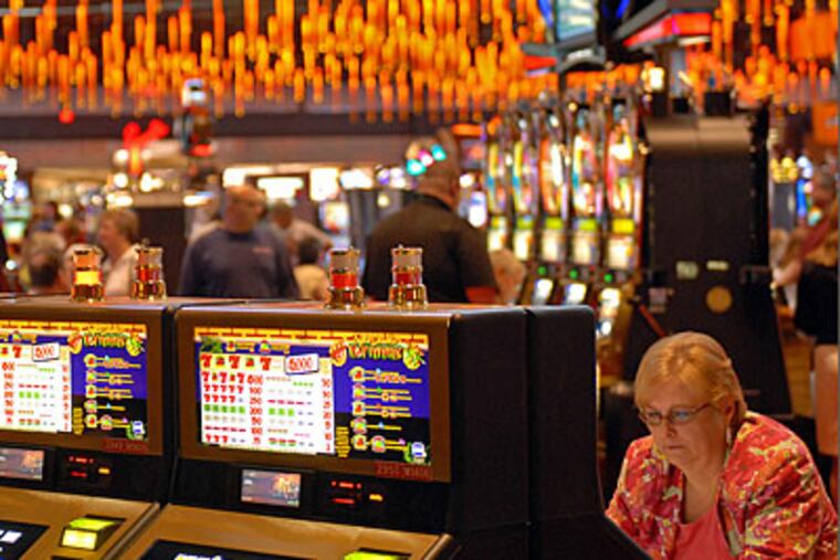 Nancy Carlson, 53, of South Plainfield, plays video slots at the
Sands Bethlehem Casino shortly after grand opening today. (Tom Gralish / Staff Photographer)