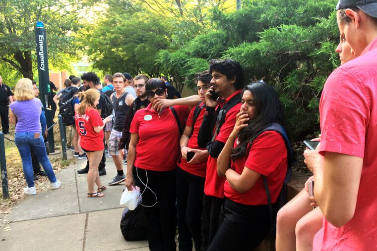 Students gather on the campus of the University of North Carolina Charlotte after a shooting Tuesday afternoon.