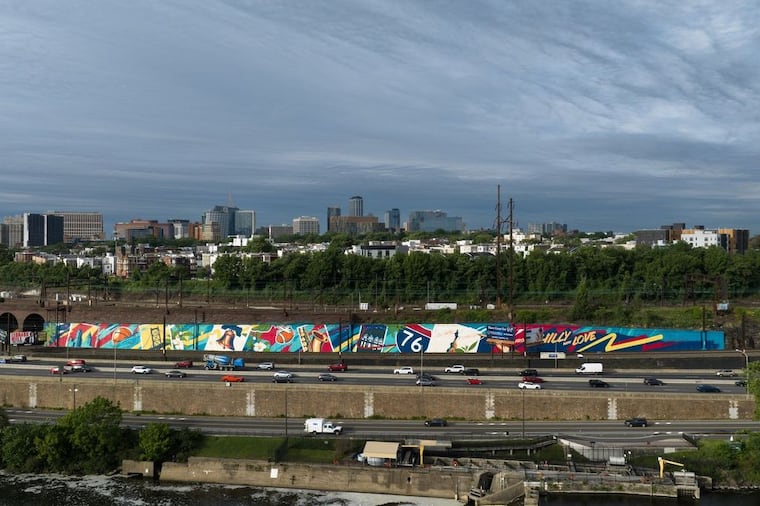 “One Philly, A United City, With Love” overlooks the I-76 with bright colors that reflect the highlights of the city.