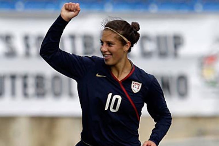 "We're making it exciting for people," Carli Lloyd said. "And giving them heart attacks." (Armando Franca/AP)