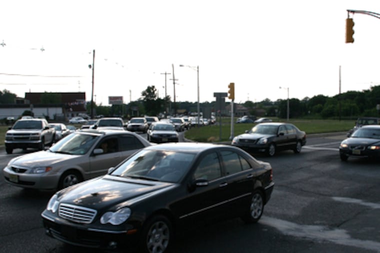 Cars drive by along Route 73 as the ones across wait in traffic along Route 70 in Marlton, NJ on Friday, June 20, 2008. (Photo by Neal Santos / Inquirer Staff Photographer).