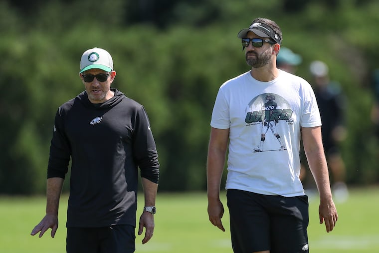 Eagles GM Howie Roseman, left, and head coach Nick Sirianni after training camp practice at the NovaCare Complex earlier this month.